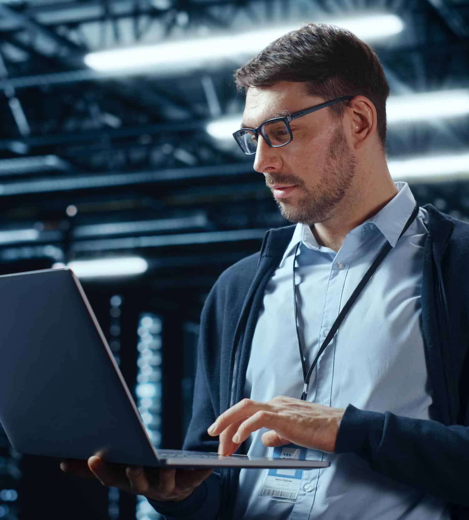 IT technician using a laptop