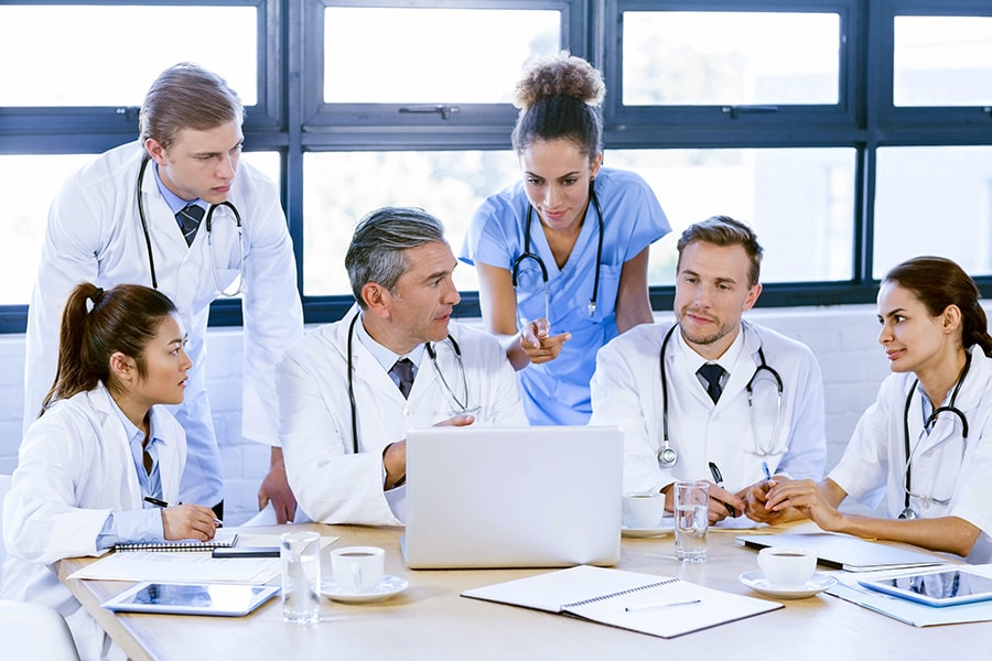 Medical team working with a laptop